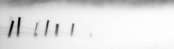 Fenceposts in a drifting blizzard